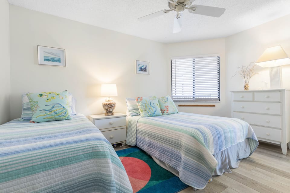 Guest bedroom with a full size and twin size bed