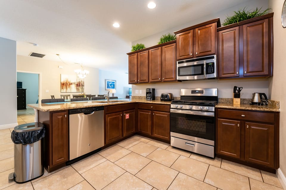 Alternate view of kitchen with stainless steel appliances