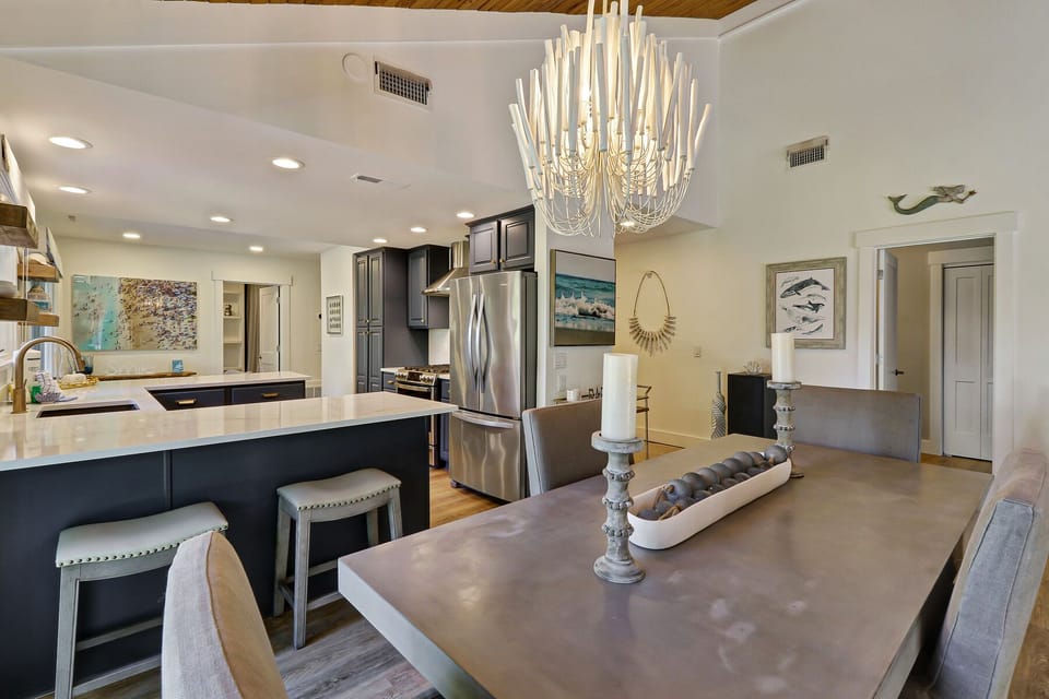 Dining table seating 4 opens to kitchen & living area