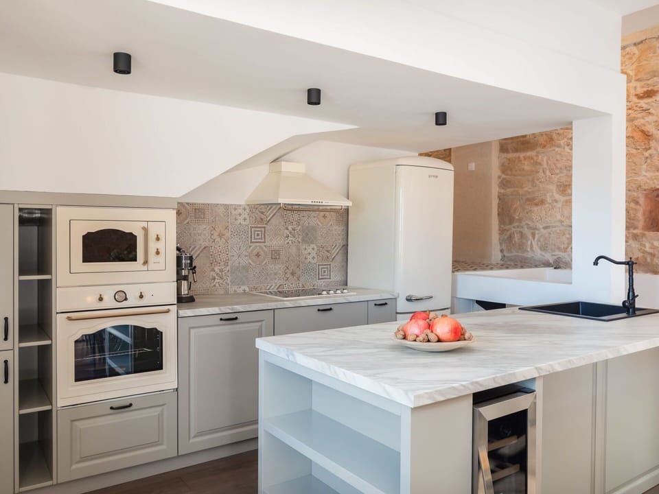 Cabinetry, Countertop, Property, Wood, Kitchen Stove, Kitchen, Lighting, Interior Design, Kitchen Appliance, Flooring
