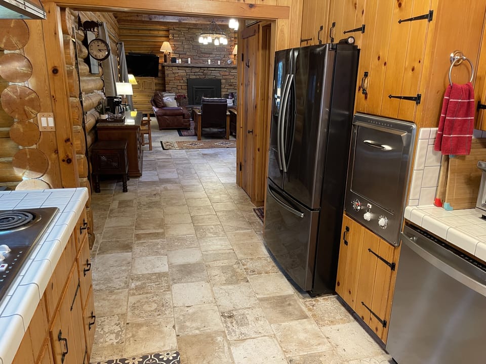 Kitchen tile has radiant floor heating.  Dishwasher, garbage disposal, ect.