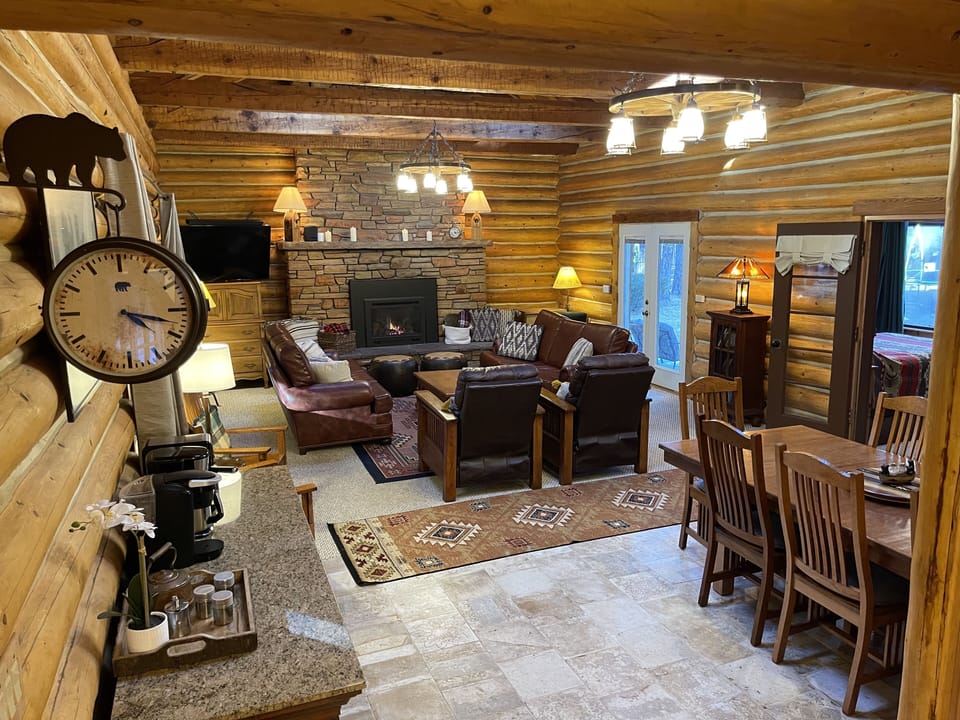 Floor to ceiling stone fireplace is gas.  Tile has radiant floor heating.