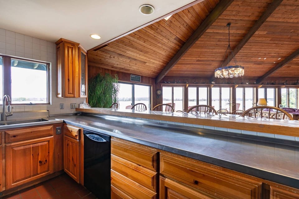 The kitchen is fully-equipped with cookware and dinnerware for 14 guests.