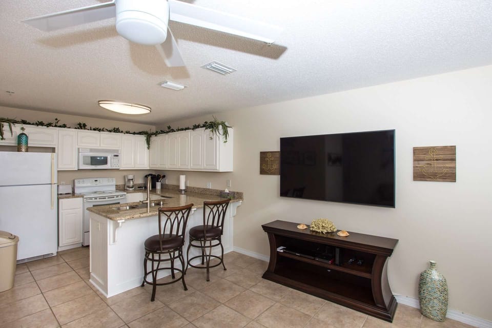 Open concept kitchen with utensils and cookware