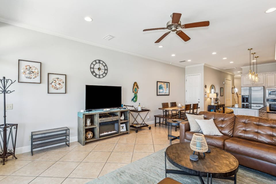 The large living room has a big screen TV with cable