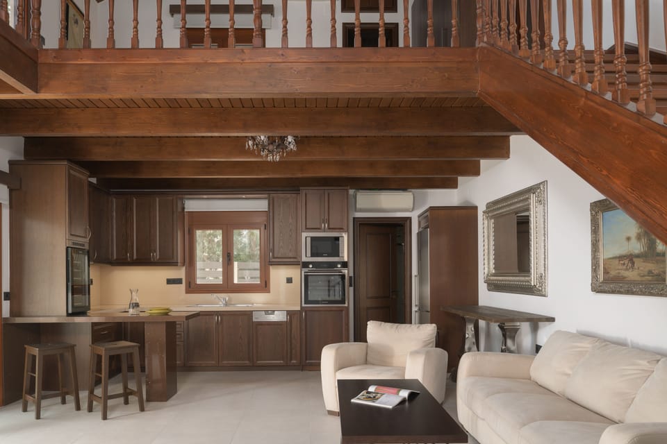 The ground floor features an open plan living room, kitchen & an extra bedroom.