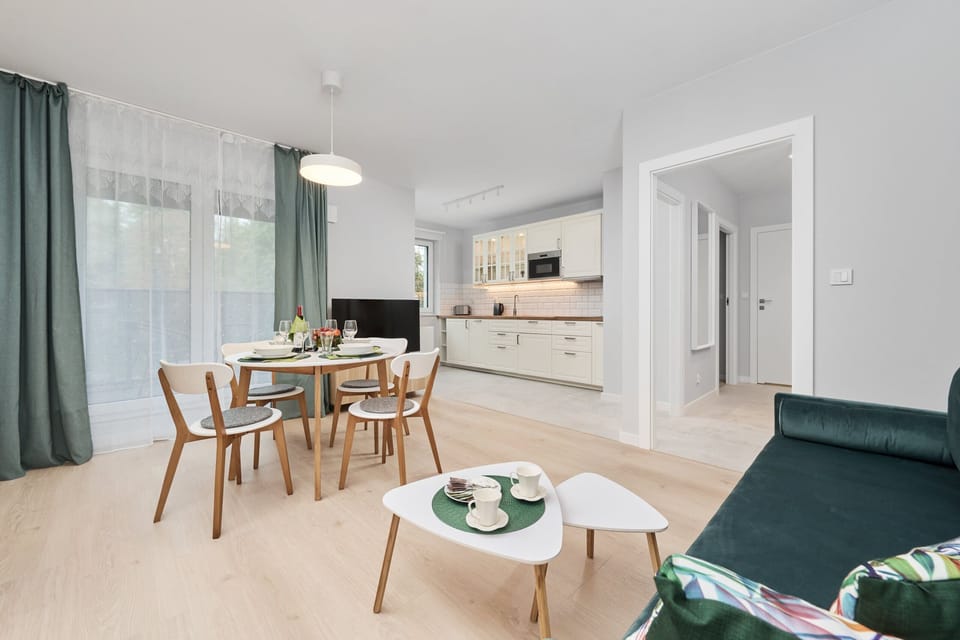 Bright open-plan layout combining a comfortable lounge with a fully equipped kitchenette, perfect for long or short stays.

