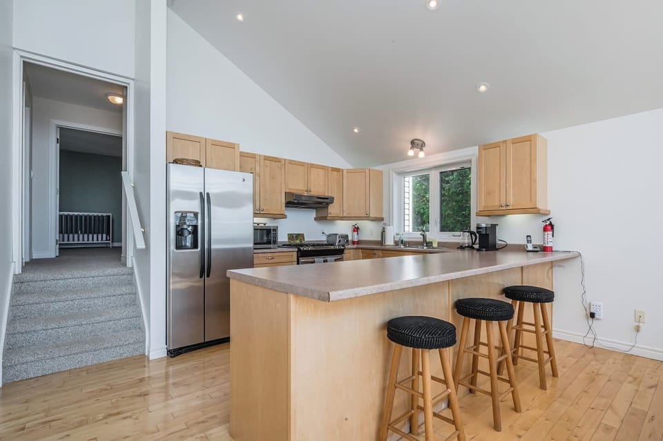 A fully stocked kitchen with eating island awaits you. It is the perfect place to entertain and share a meal. 