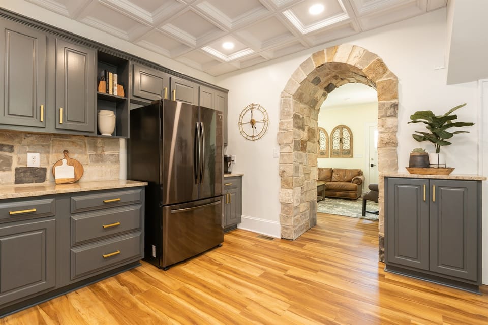 Grand stone archway into the Living Room