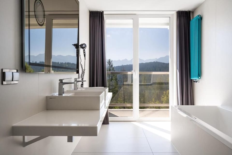 Luxury Suite, Balcony, Mountain View | Bathroom | Separate tub and shower, free toiletries, hair dryer, slippers