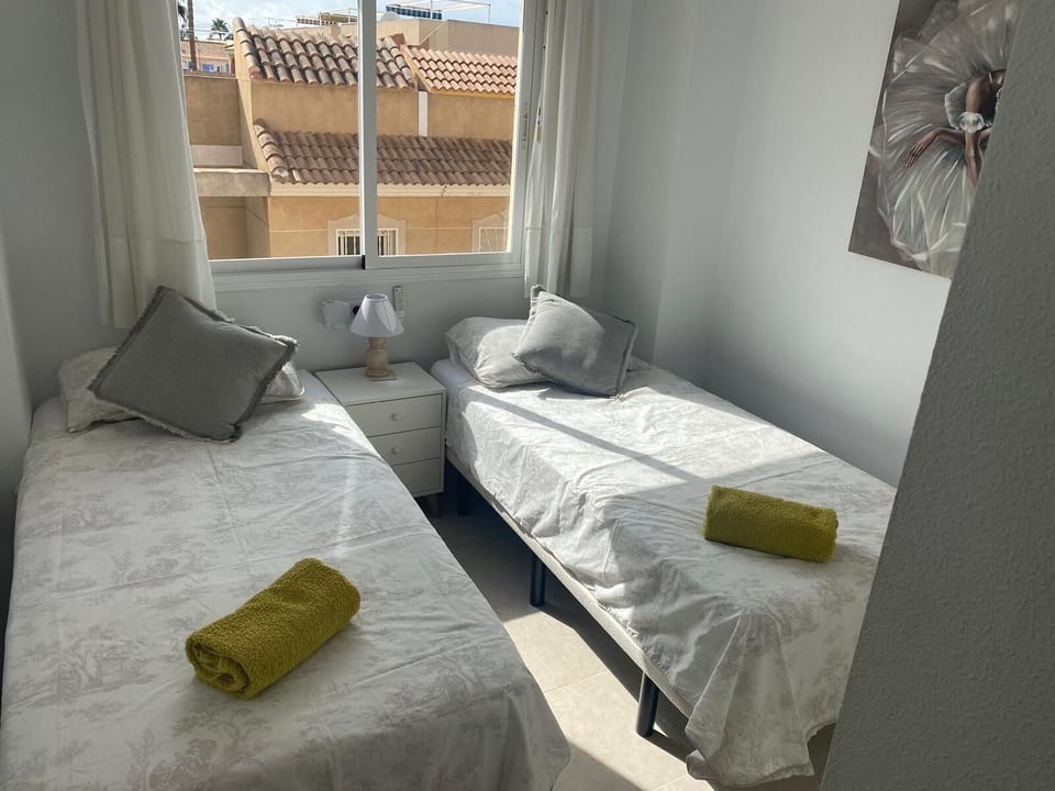 twin bedroom with double wardrobe with plenty of hangers