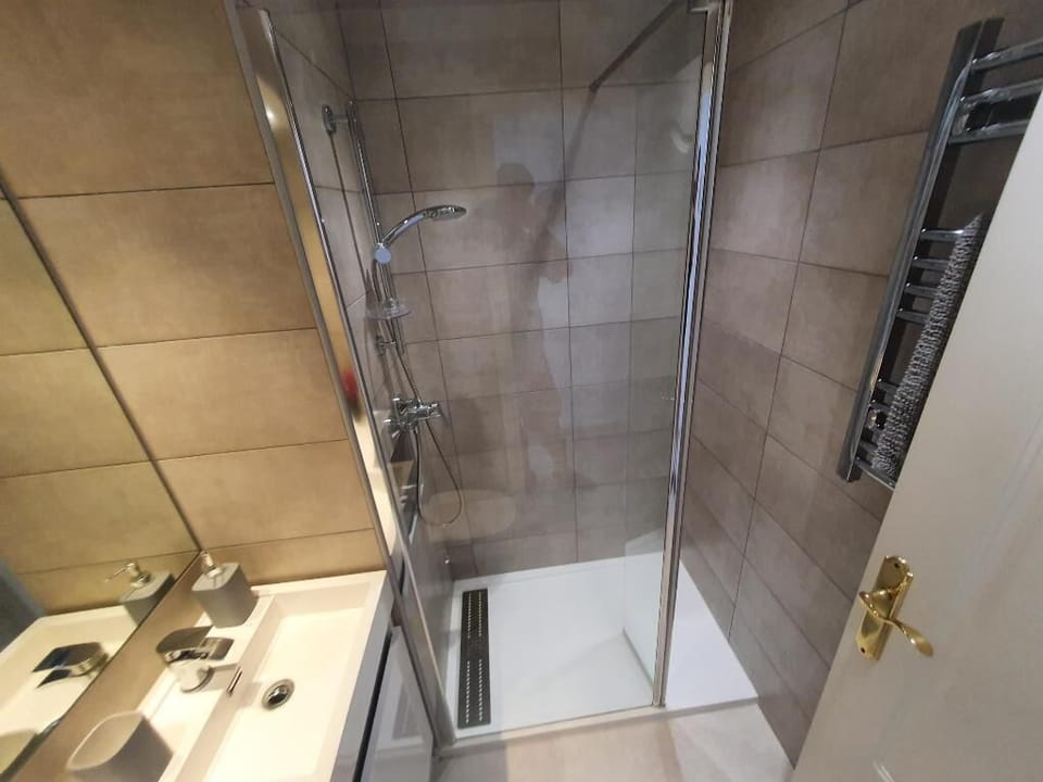 Bathroom two with storage under sink for   toiletries and heated towel rail
