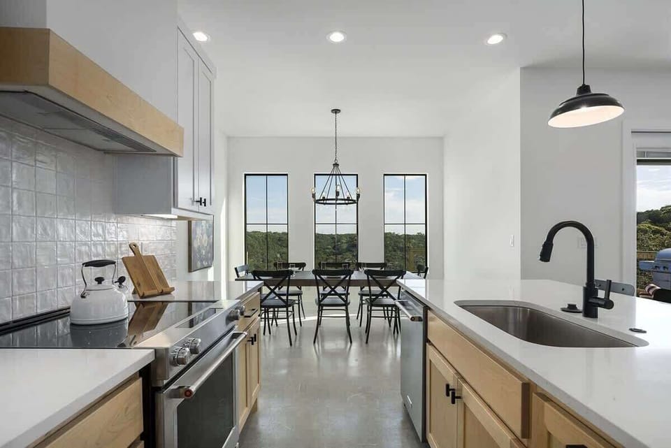 Experience the joy of cooking in this beautifully designed kitchen with modern appliances and sleek countertops