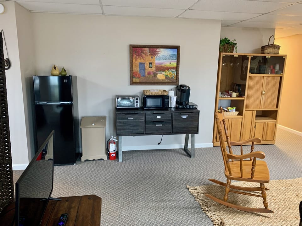 Coffee/tea/snack area with toaster oven, microwave, refrigerator, Keurig machine