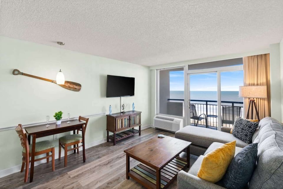 Kick back in coastal comfort—this oceanfront living space pairs beachy charm with front-row Atlantic views, perfect for morning coffee, Netflix nights, or sipping wine while the sun melts into the waves.