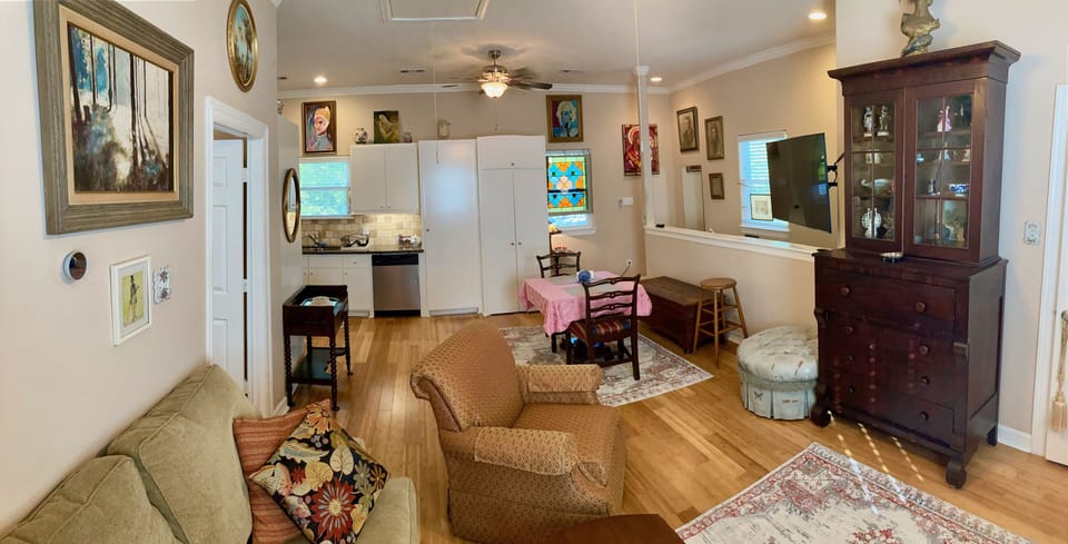 living area has swivel mounted 55" Samsung Smart TV and butlers desk