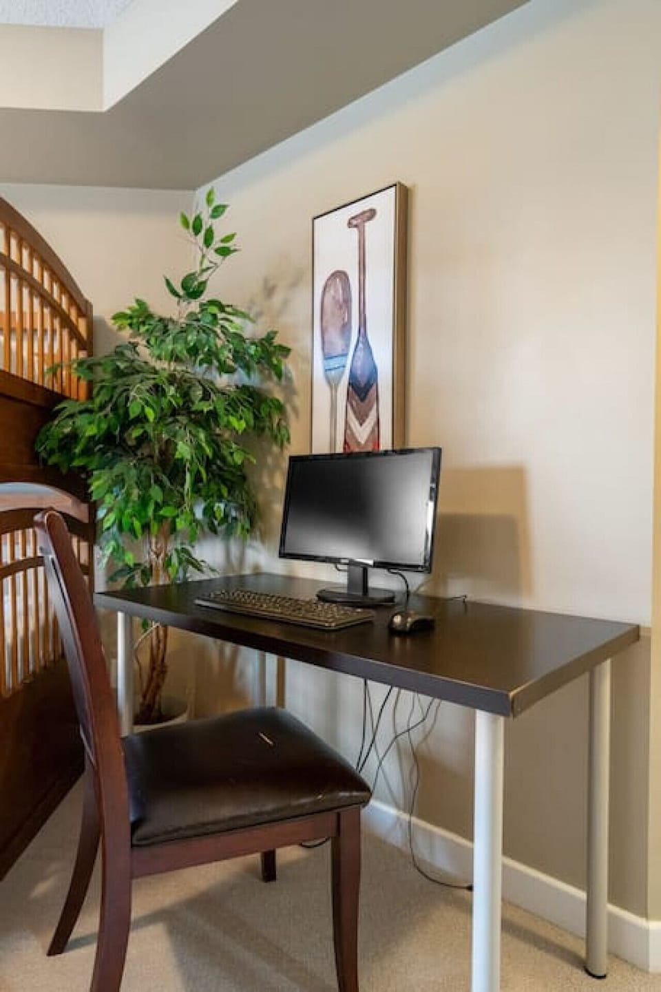 Second bedroom with a single-over-double bunk bed, closet and a dedicated workstation.