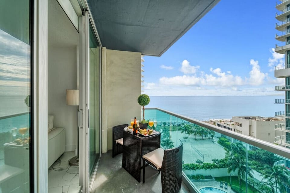 Spectacular balcony dining experience with unobstructed ocean views and comfortable seating