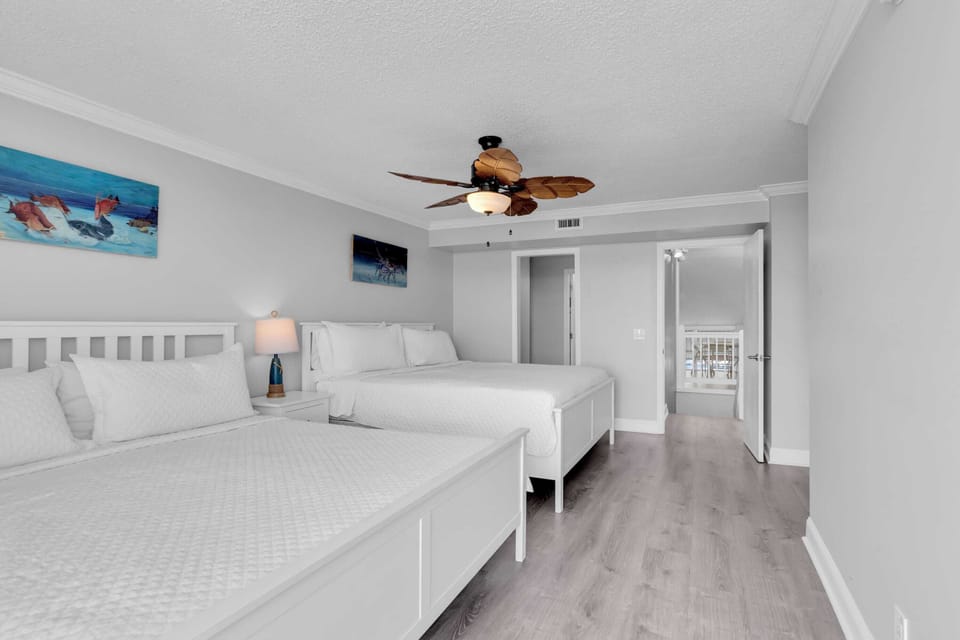 2nd floor two-King bedroom, access to balcony and en-suite bathroom