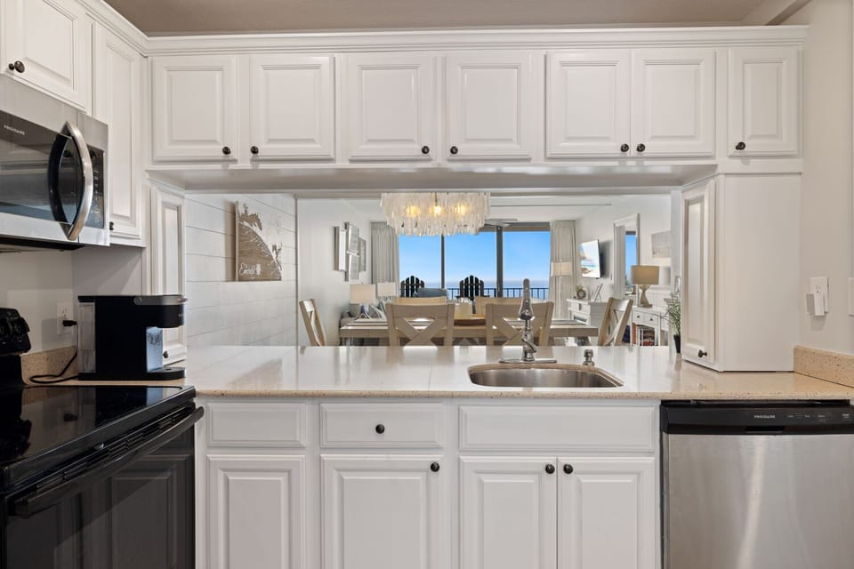 The pass-through layout makes food served from the kitchen counter easy to grab from the dining area. Enjoy the view as you prep or clean up!