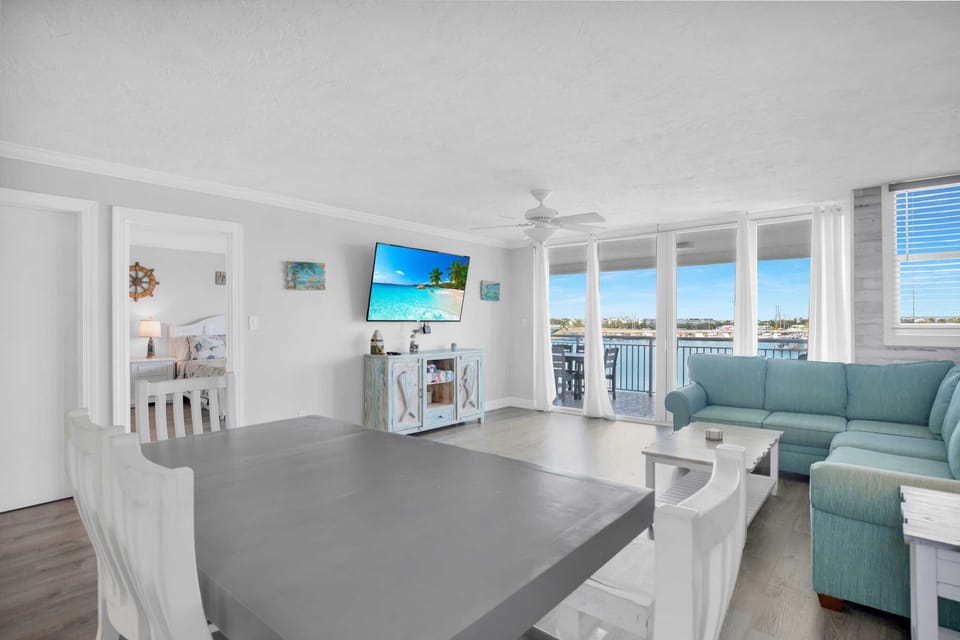 Living area with ceiling to floor sliding glass doors to private balcony