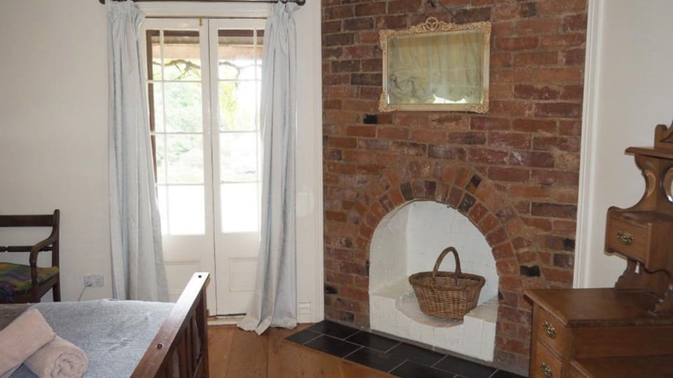 Bedroom 1 with lovely french doors to the verandah