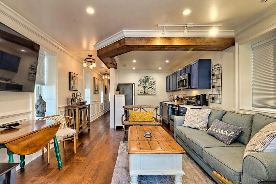 The living area feature ample lighting and is located just steps away from the kitchen
