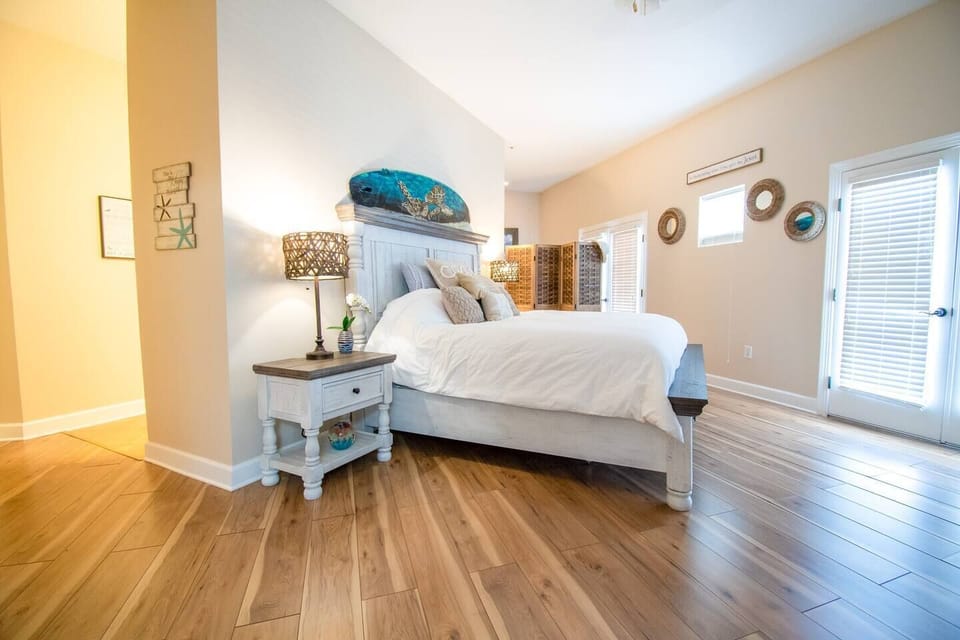 The master bedroom features a king-sized bed with a premium Marriott pillow top, 55" TV, full en-suite, providing plenty of space and comfort for your stay.