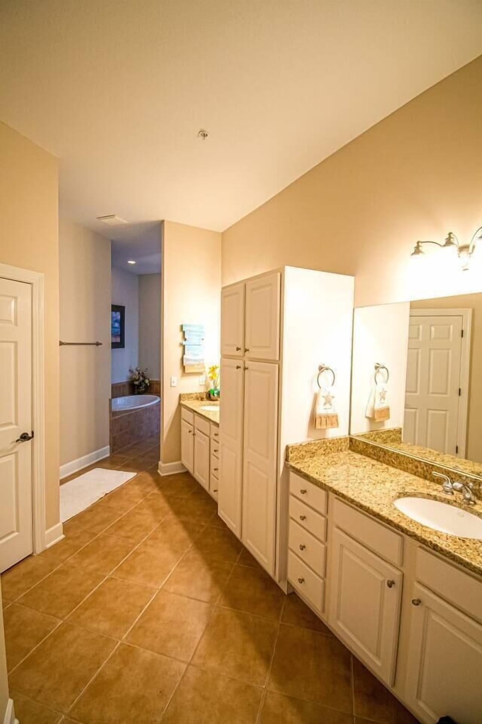 Dual counters and sinks in the master bathroom provide plenty of personal space, ensuring comfort and convenience for residents.