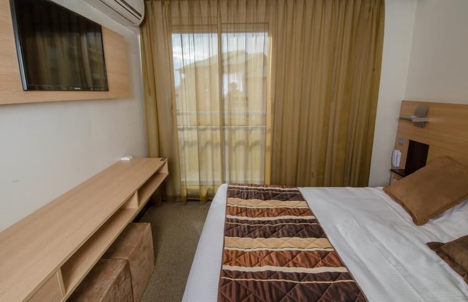 Relax on the comfy bed after a day outside.