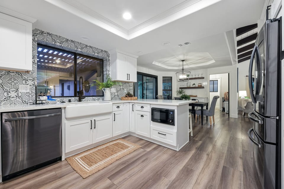 The kitchen in the main house has all new appliances and a farmhouse sink.