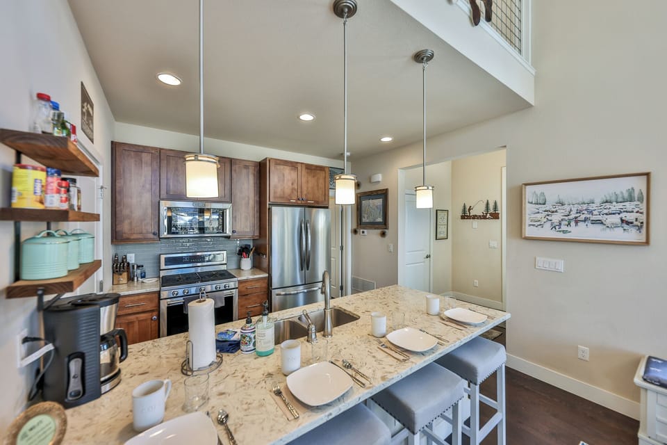 Well stocked kitchen with counter bar for casual eating.
