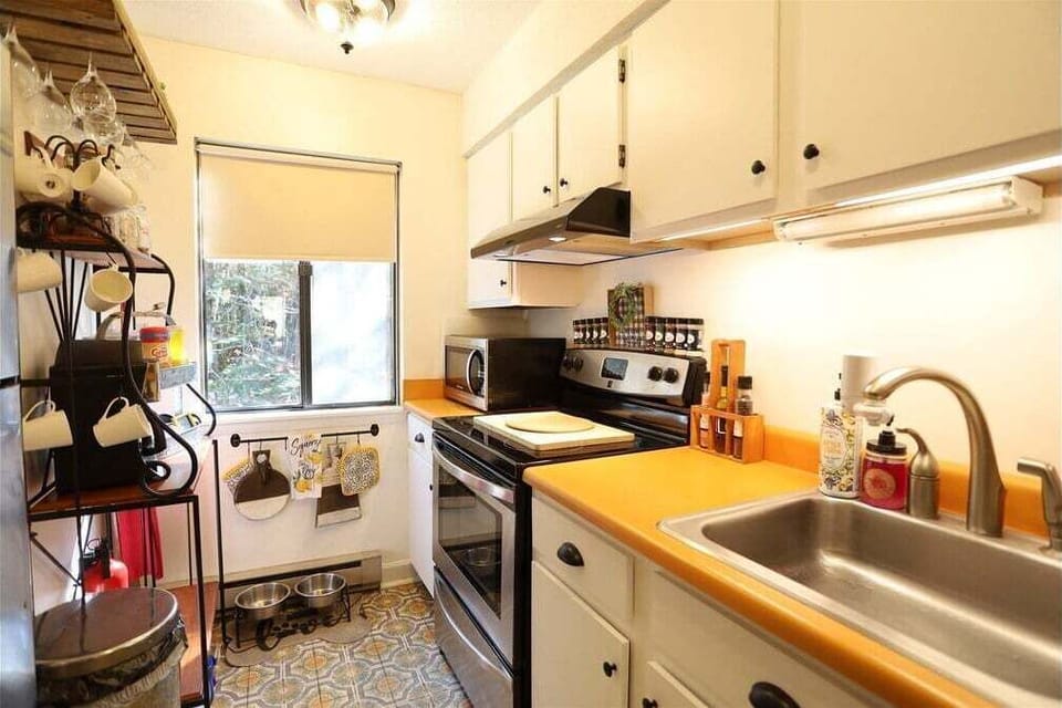 Kitchen with Stove and Microwave at Condo