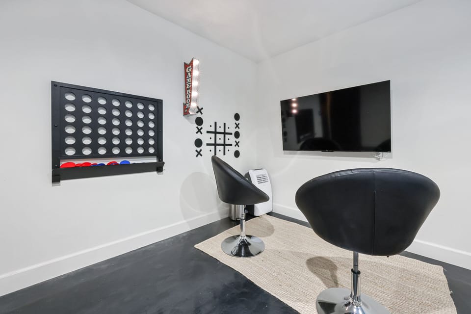There is a game room on the other side of the garage. Play tic tac toe and connect four on the wall.