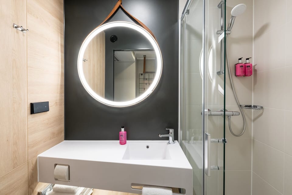 Combined shower/tub, hair dryer, towels, soap