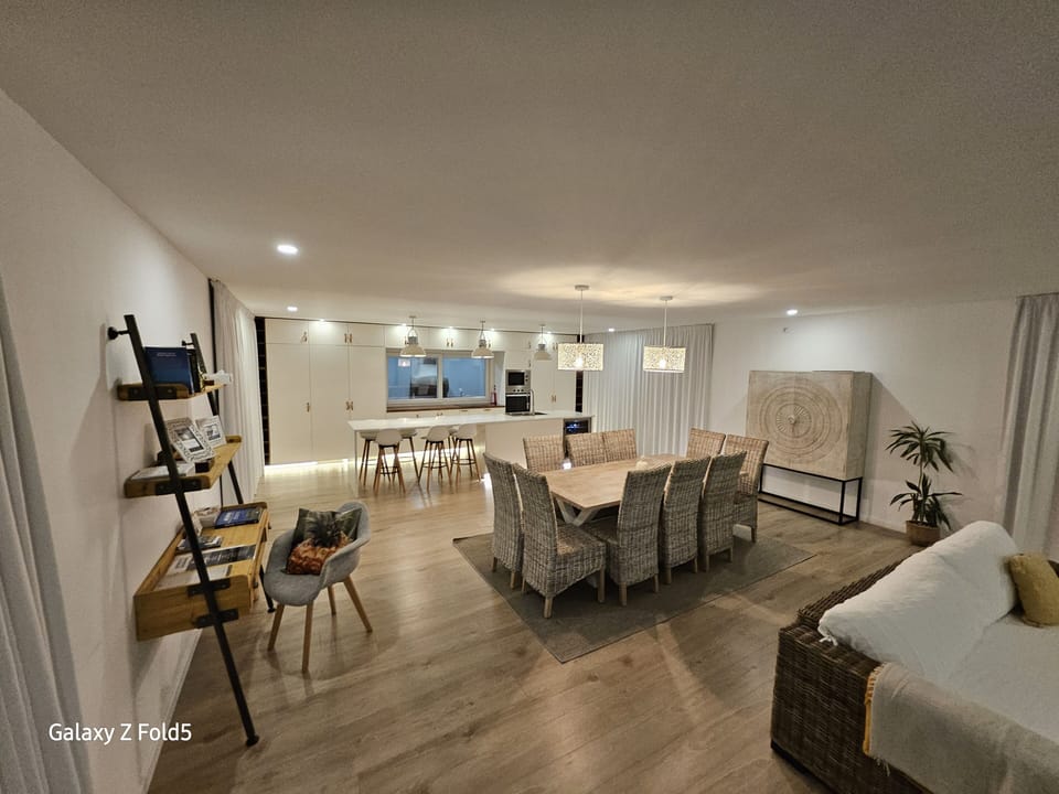 Open space concept: Living room, work place, dinning room and kitchen