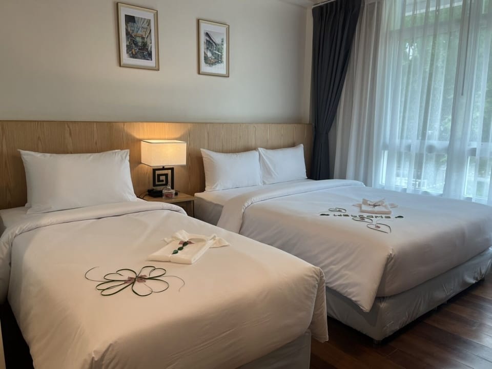 Family Triple Room | Hypo-allergenic bedding, in-room safe, iron/ironing board, free WiFi