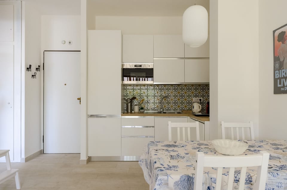 Apartment | Private kitchen | Espresso maker, dining tables