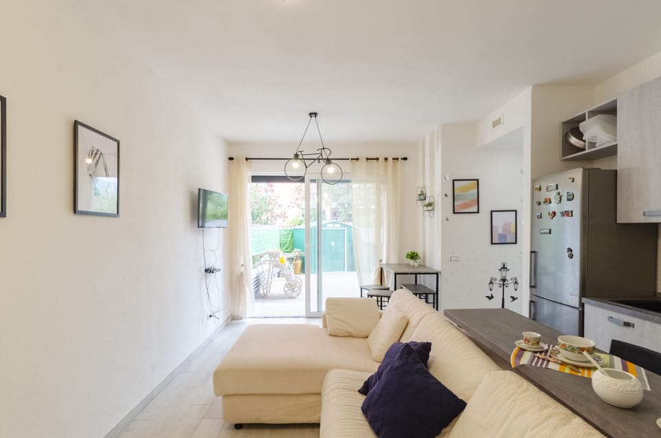 Apartment, 2 Bedrooms, Patio | Living area | 20-inch flat-screen TV with cable channels, TV