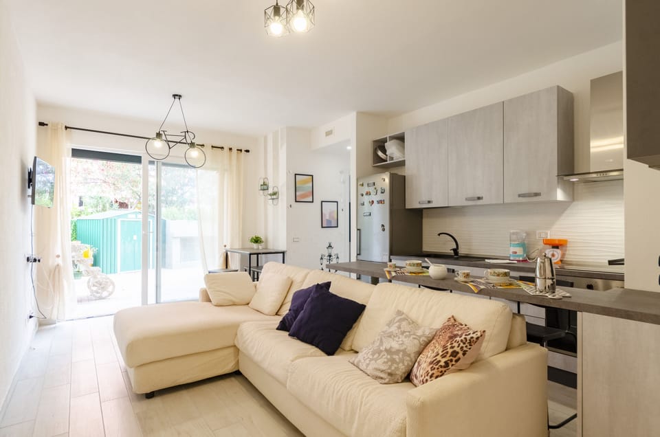 Apartment, 2 Bedrooms, Patio | Living area | 20-inch flat-screen TV with cable channels, TV