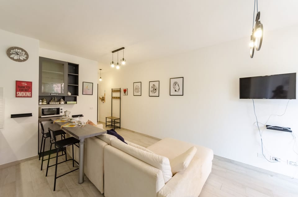 Apartment, 2 Bedrooms, Patio | Living area | 20-inch flat-screen TV with cable channels, TV