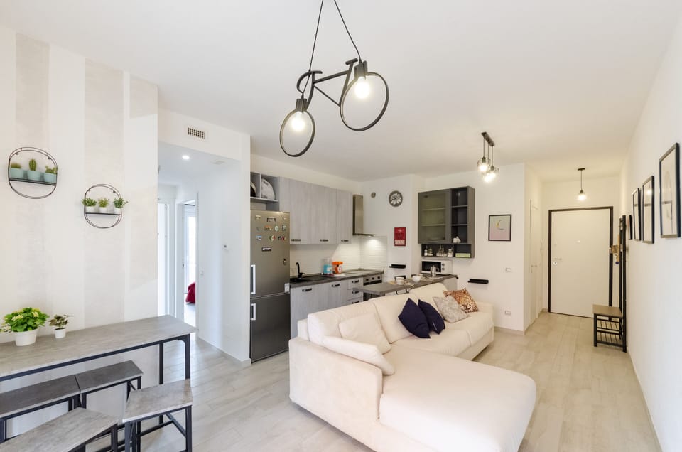 Apartment, 2 Bedrooms, Patio | Living area | 20-inch flat-screen TV with cable channels, TV