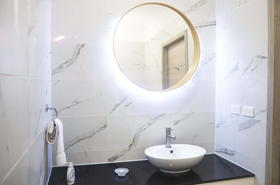 Shower, rainfall showerhead, hair dryer, towels