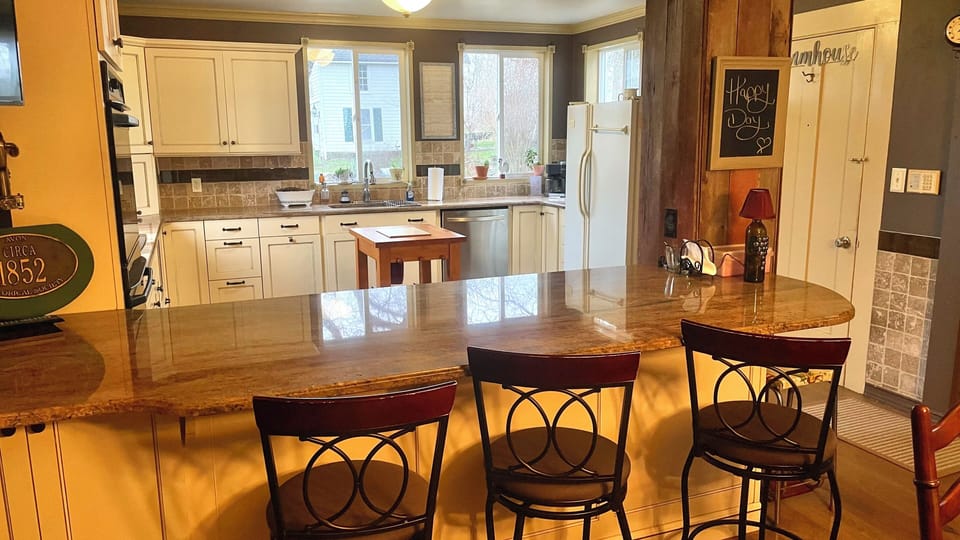 View from breakfast bar into kitchen.