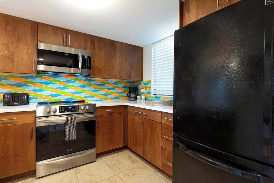 Condo, Multiple Beds, Lanai, Partial Ocean View (White Sands Village #129) | Private kitchen | Fridge, oven, stovetop, dishwasher