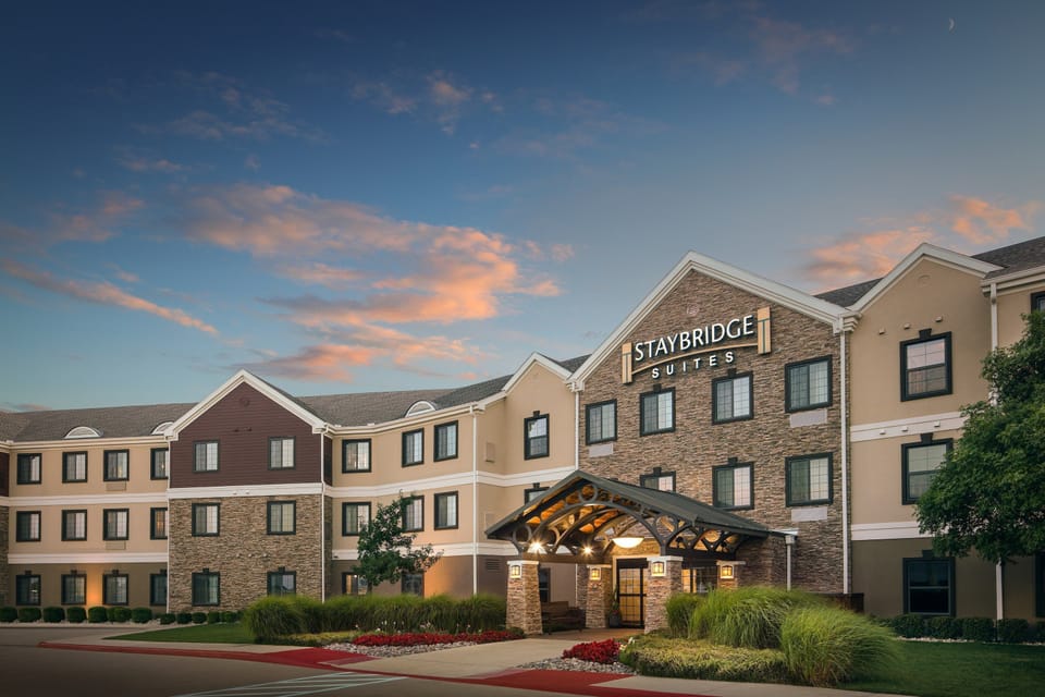Exterior view of a multi-story building at dusk.