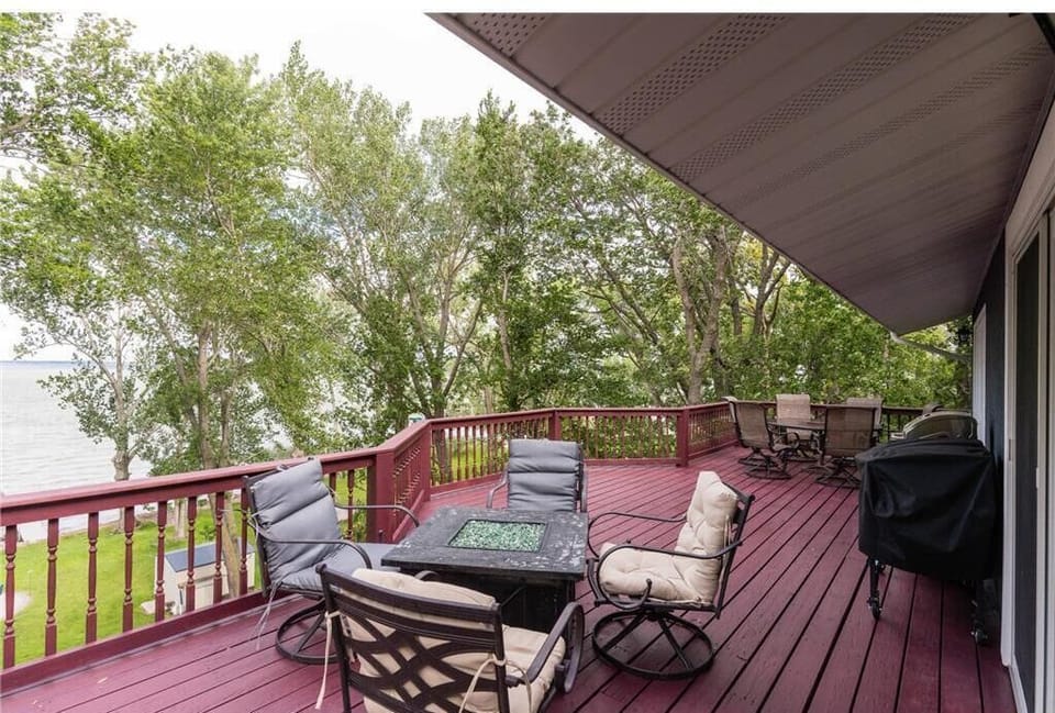 Enjoy grilling and the expansive outdoor deck with plentiful seating.
