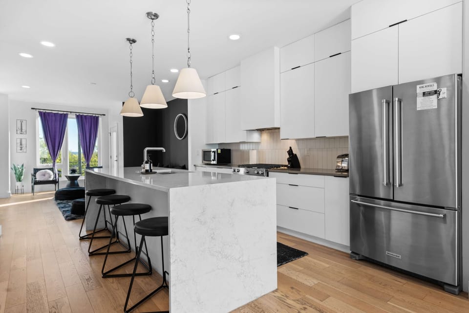 Seamless flow between the fully equipped kitchen and living area.