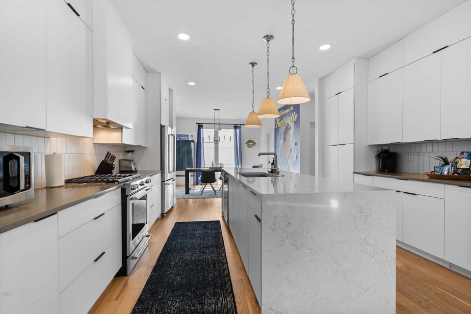 Well-equipped kitchen complete with stainless steel appliances.