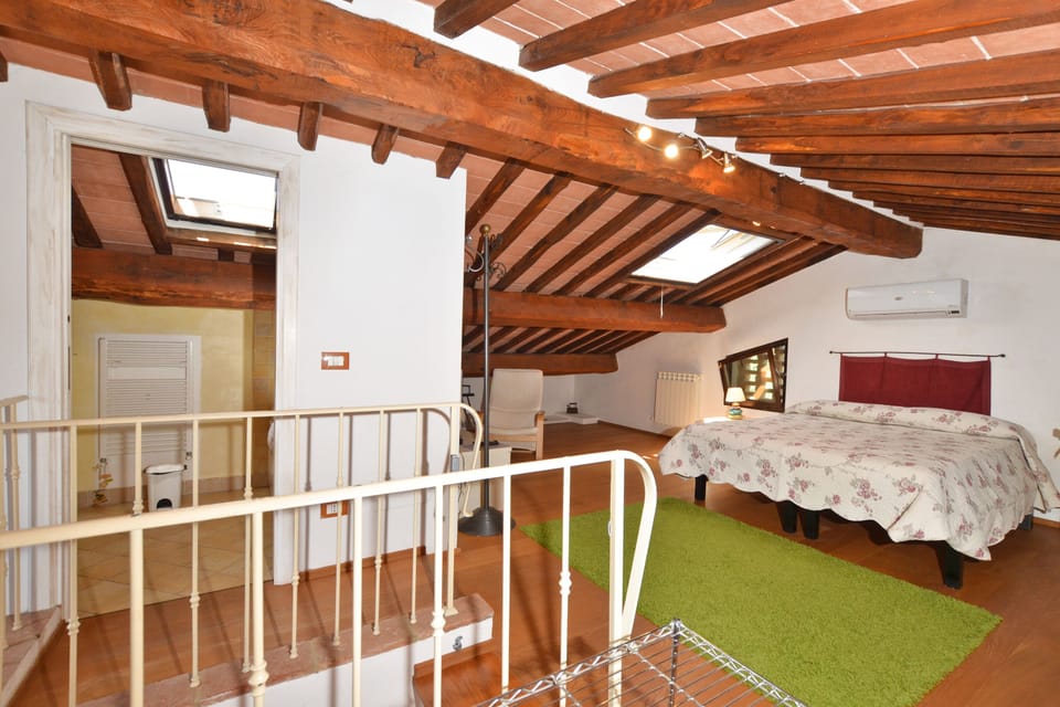 The double bedroom upstairs in the open mansarda